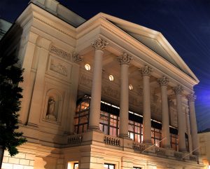 A nighttime, external shot of the Royal Opera House, London