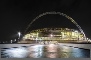 An external, nighttime shot of London's Wembley stadium