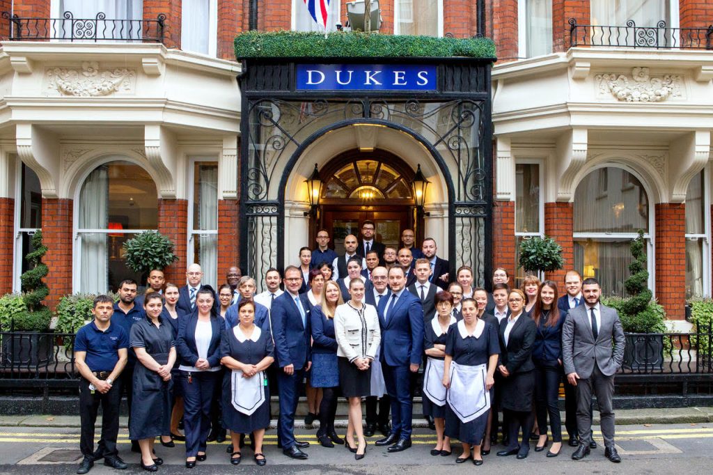 The DUKES LONDON team celebrating award win outside of the hotel